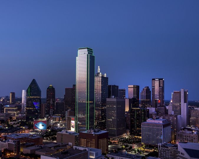 Downtown Dallas skyline lit up at dusk