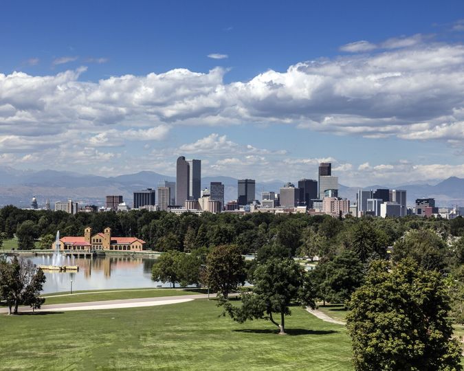 Denver skyline and the Front Range across the lake in City Park
