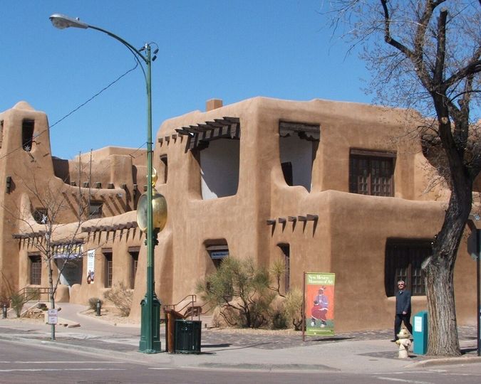 Adobe New Mexico Museum of Art on a street corner in downtown Santa Fe